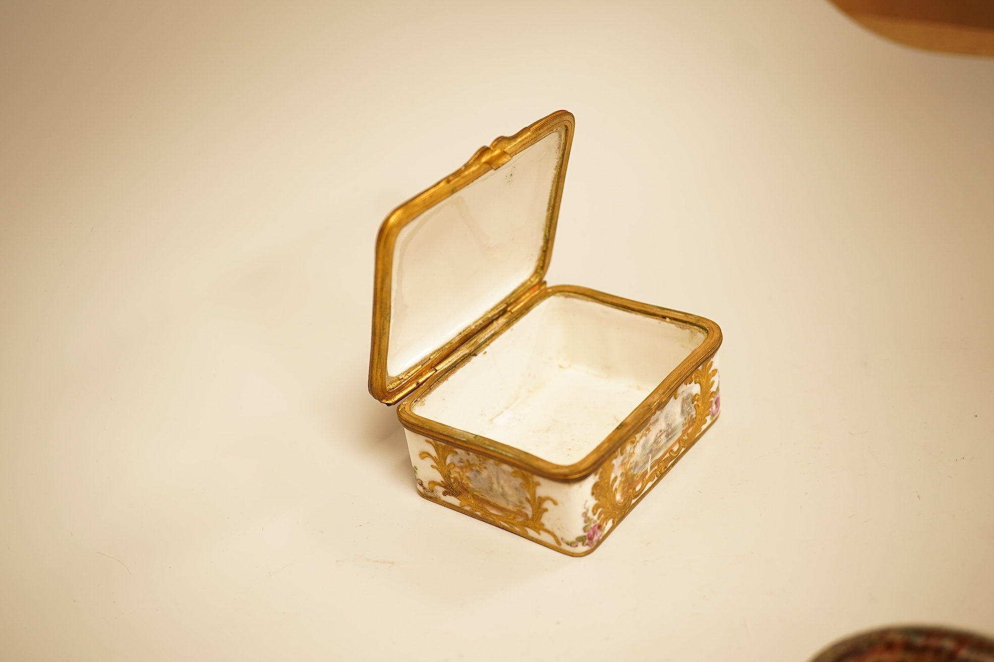 A Zsolnay lustre 'chicken' box and cover and two Sevres style porcelain boxes and covers (3) ‘chicken box’ 5cm diameter.